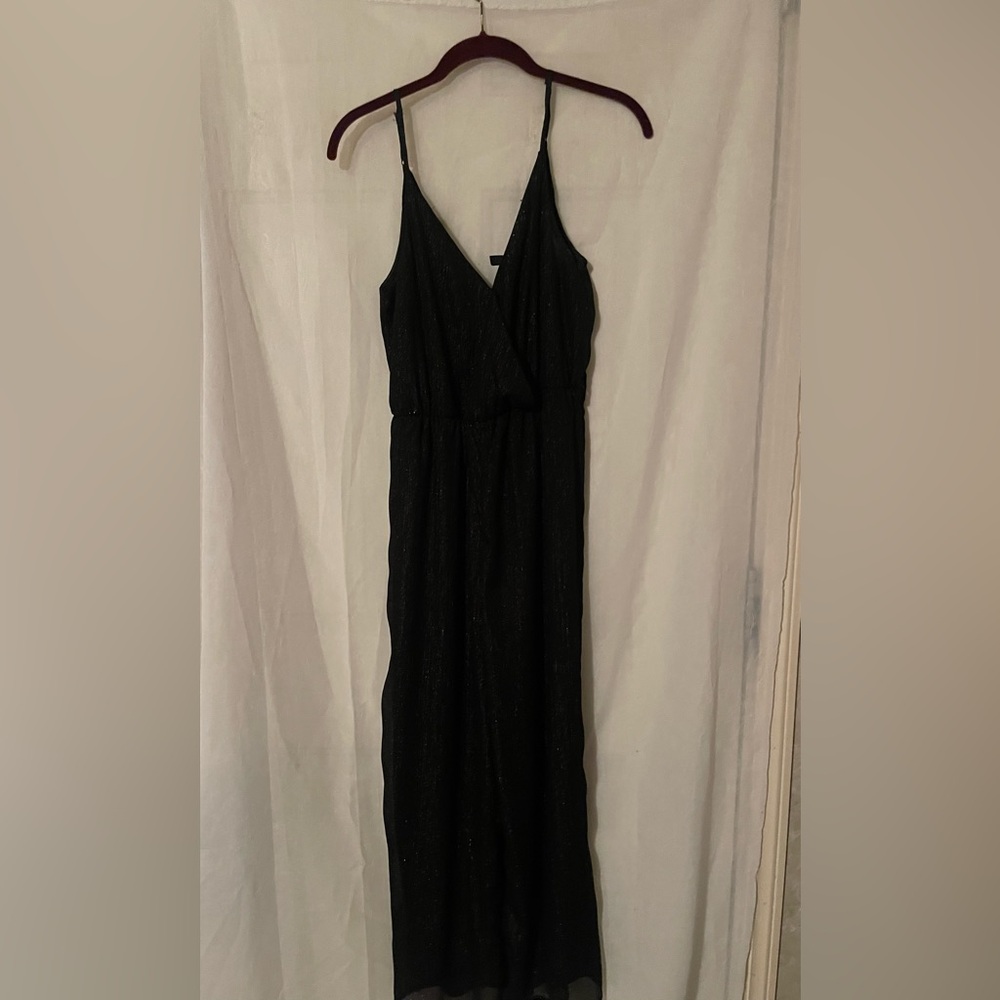 Divided Black jumpsuit. Can be worn summer or winter. Perfect condition